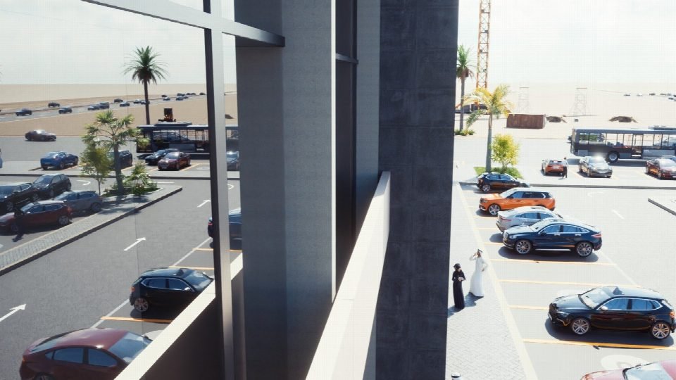 View along the façade over the parking.