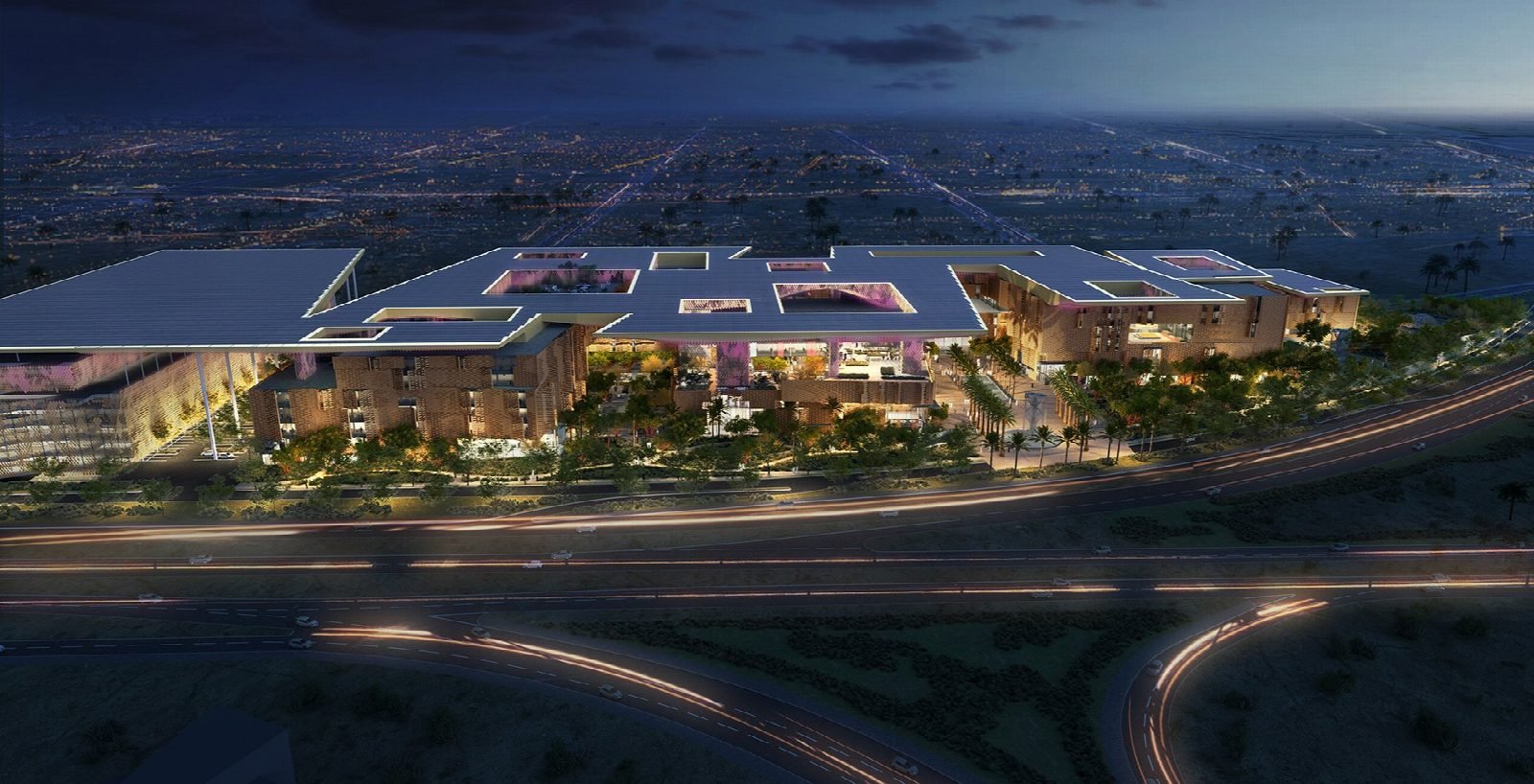 Night aerial render of the campus.