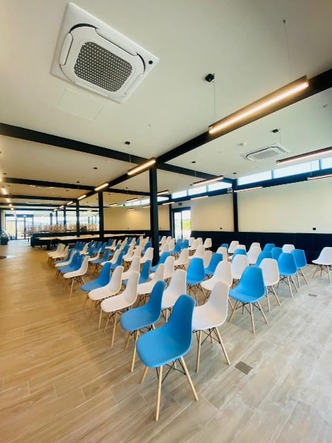 Dining hall with seating installed.