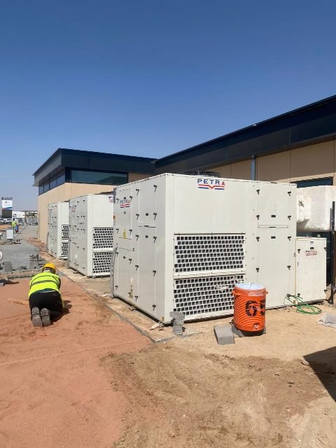 Packaged HVAC units installed beside the building.