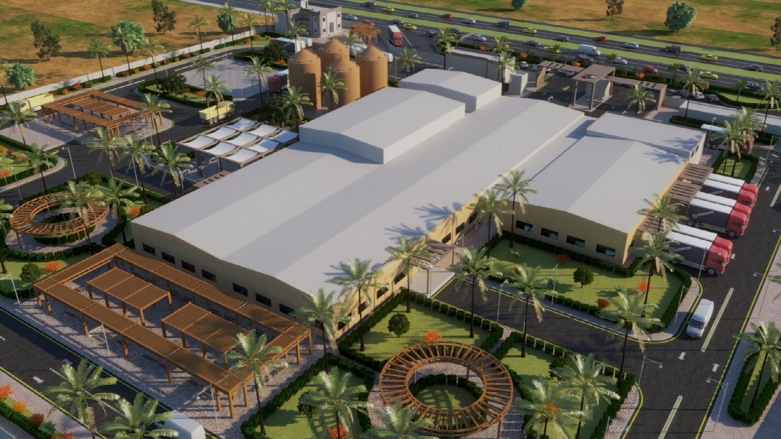Aerial view of the production hall, silo battery and landscaped entrance.